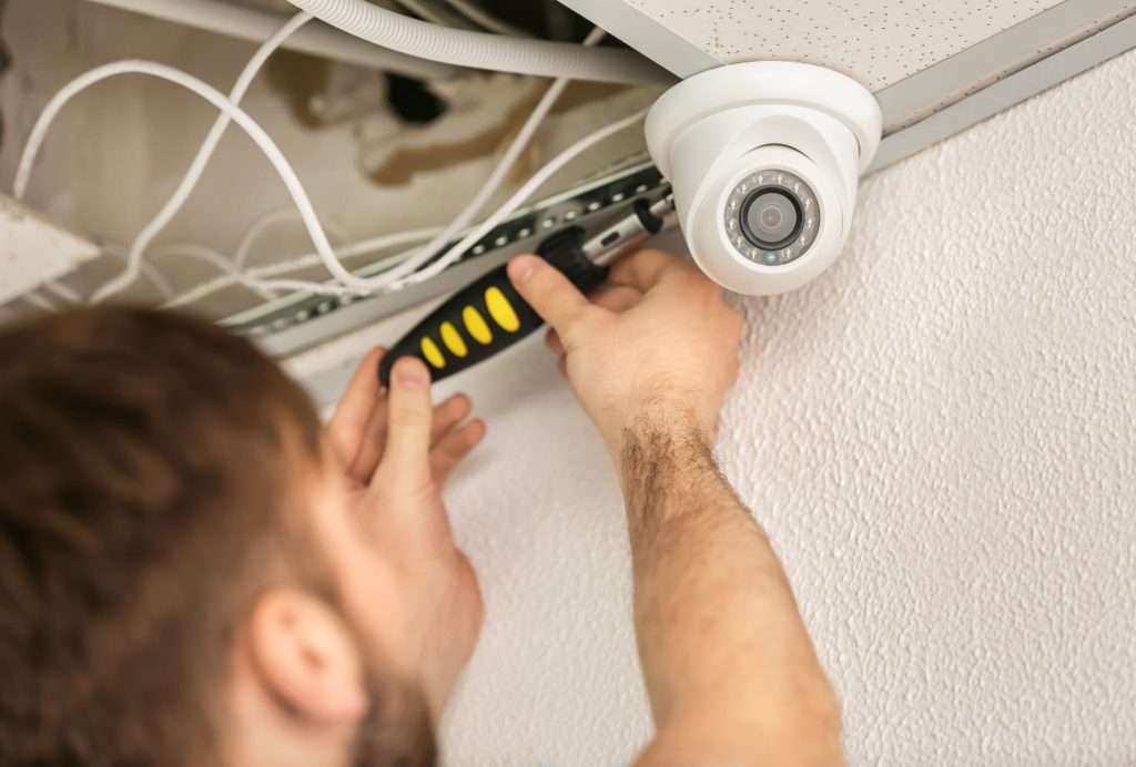 electrician fixing CCTV