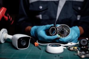 Technician under fixed and repairing cctv board