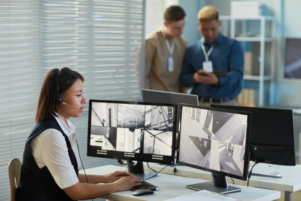 Woman watching surveillance camera